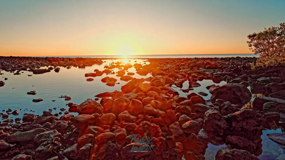 Volcanic red rocks illuminated by dawn sun rays Australian geological formation