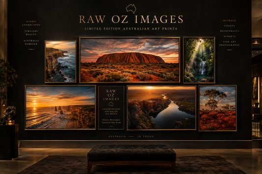 Gallery wall of framed limited edition Australian landscape prints by Raw Oz Images: Uluru, coast and rainforest scenes.