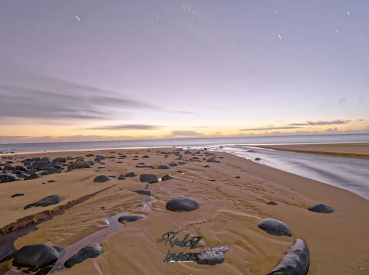 First light of dawn breaking over Australian coastal landscape