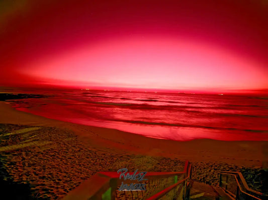 Long exposure night photography of ships at sea with red twilight sky